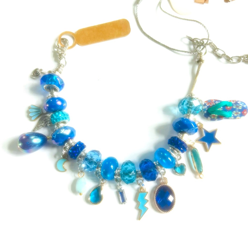 Charm bracelet 11 inches long made for the larger wrist this is beautiful blue